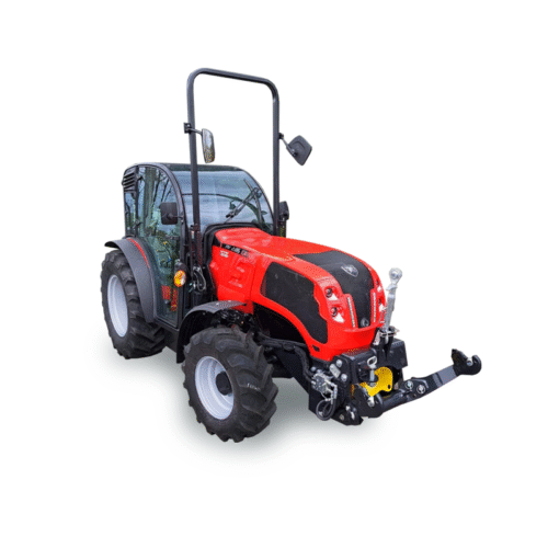 Red agricultural tractor with roll bar and front hitch, angled view showing cab and large rear tires.